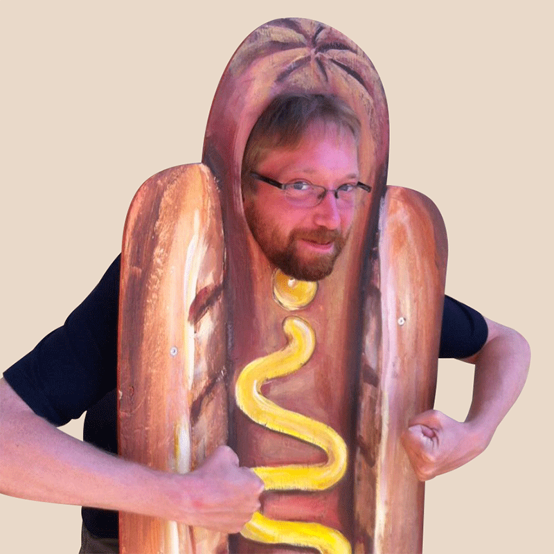 Mark dancing while wearing a hotdog suit